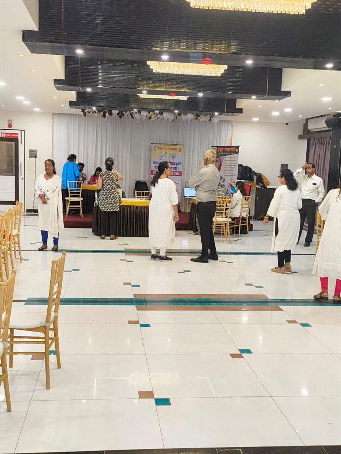 Hospital waiting hall with visitors during a camp